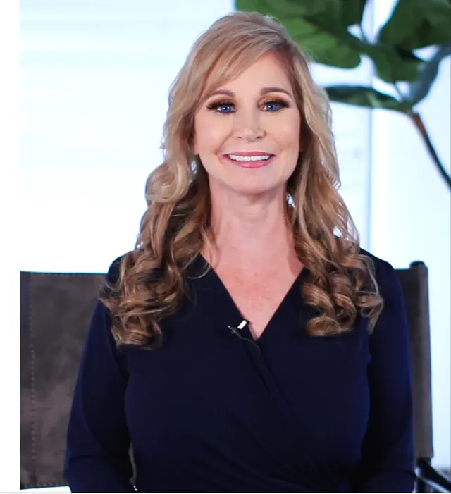 Debra George speaking to the camera